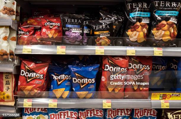Doritos American tortilla chips snack are displayed for sale at a supermarket in Hong Kong. As United State president Donald Trump signed the bill to...