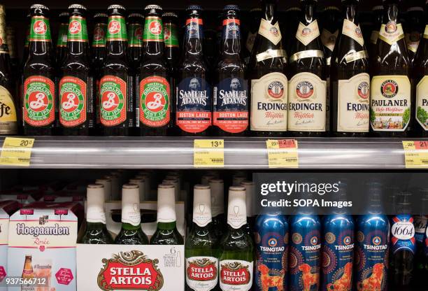 America brand beer Samuel Adams, at the center of the picture, are displayed for sale at a supermarket in Hong Kong. As United States president...