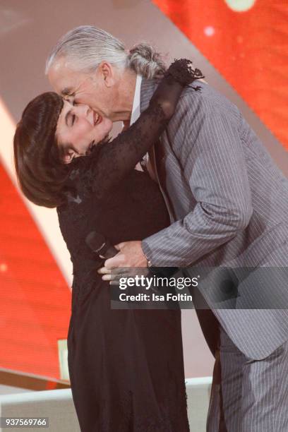 French singer Mireille Mathieu and US actor Patrick Duffy during the tv show 'Willkommen bei Carmen Nebel' on March 24, 2018 in Hof, Germany. The...