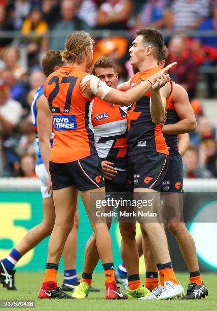 Jeremy Cameron of the Giants celebrates a goal with team mates during the round one AFL match between the Greater Western Sydney Giants and the...