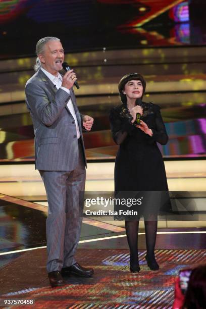 French singer Mireille Mathieu and US actor Patrick Duffy perform during the tv show 'Willkommen bei Carmen Nebel' on March 24, 2018 in Hof, Germany....