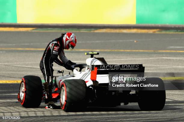 Kevin Magnussen of Denmark and Haas F1 climbs from his car after retiring during the Australian Formula One Grand Prix at Albert Park on March 25,...