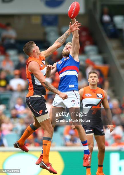 Rory Lobb of the Giants and Jackson Trengove of the Bulldogs contest possession during the round one AFL match between the Greater Western Sydney...