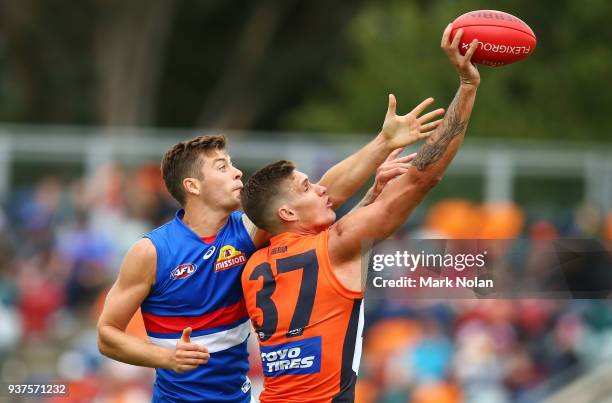 Rory Lobb of the Giants and Josh Dunkley of the Bulldogs contest possession during the round one AFL match between the Greater Western Sydney Giants...