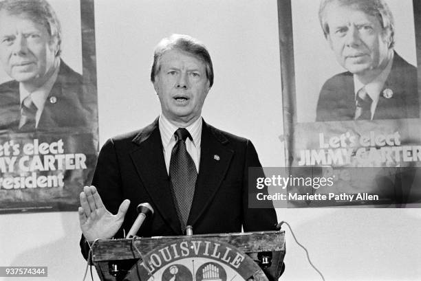 Louisville, Kentucky, USA Then Governor of Georgia, Jimmy Carter stands in front of posters saying 'Let's Elect JIMMY CARTER President' and addresses...