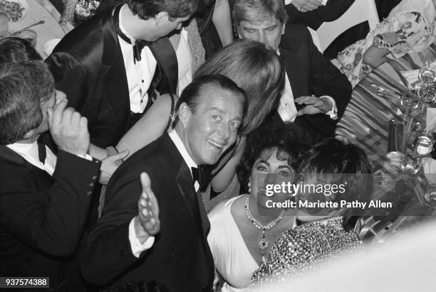 New York, New York, USA Fashion designer, Halston, actress Elizabeth Taylor and singer and actress Liza Minnelli smile at the opening night party for...