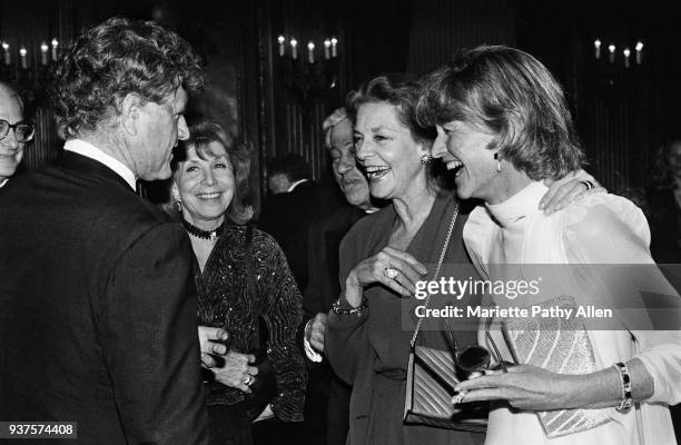 New York, New York, USA Senator Edward M Kennedy speaking with playwright and lyricist Betty Comden and Adolph Green, actress Lauren Bacall and his...