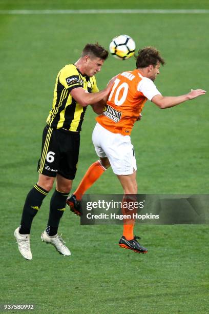 Dylan Fox of the Phoenix and Brett Holman of the Roar compete for a header during the round 24 A-League match between the Wellington Phoenix and the...
