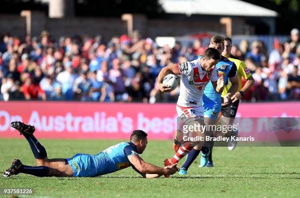 Ben Hunt of the Dragons breaks through the defence during the round three NRL match between the Gold Coast Titans and the St George Illawarra Dragons...