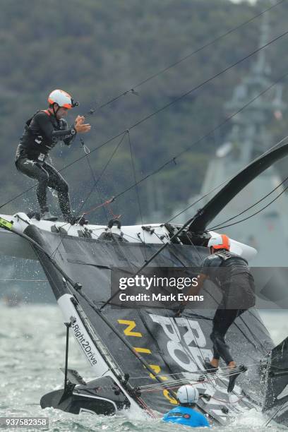 The crew of Record Point recover from a capsize during the Super Foilers Grand Prix at Sydney Harbour on March 25, 2018 in Sydney, Australia.