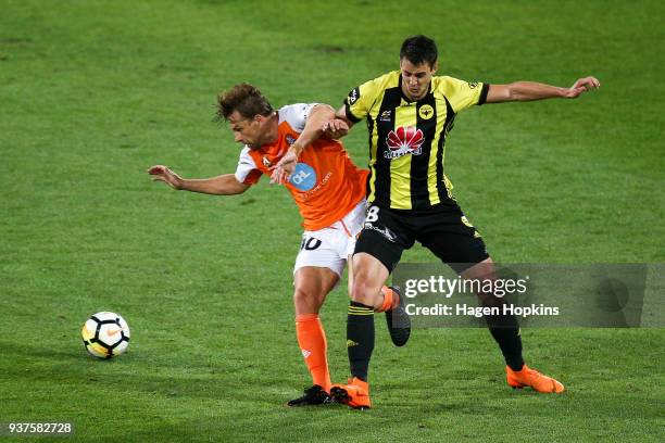 Brett Holman of the Roar and Matija Ljujic of the Phoenix compete for the ball during the round 24 A-League match between the Wellington Phoenix and...