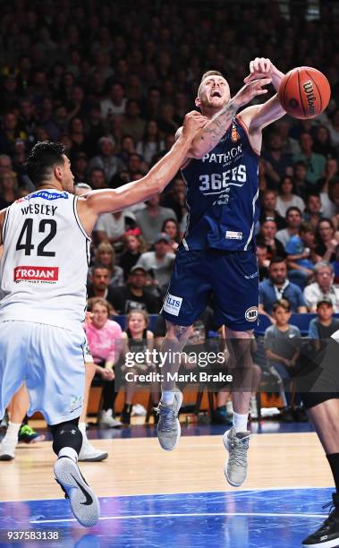 Mitch Creek of the Adelaide 36ers gets fouled bby Tai Wesley of Melbourne United during game four of the NBL Grand Final series between the Adelaide...