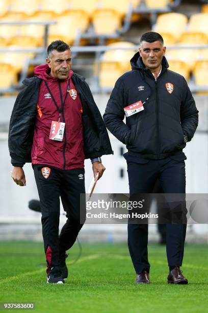 Coach John Aloisi and assistant coach Ross Aloisi of the Roar look on during the round 24 A-League match between the Wellington Phoenix and the...