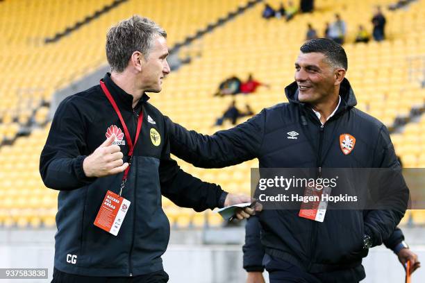 Coaches Chris Greenacre of the Phoenix and John Aloisi of the Roar speak during the round 24 A-League match between the Wellington Phoenix and the...