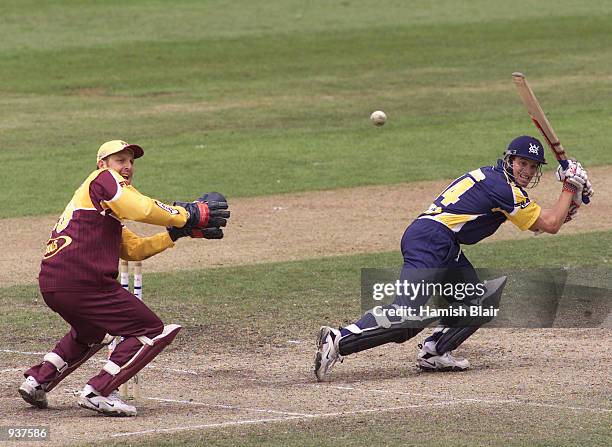 Michael Klinger of Victoria hits out, with Wade Seccombe of Queensland looking on, during his innings of 72, during the ING Cup match between...