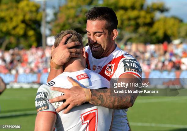 Paul Vaughan and Matthew Dufty of the Dragons celebrate victory after the round three NRL match between the Gold Coast Titans and the St George...