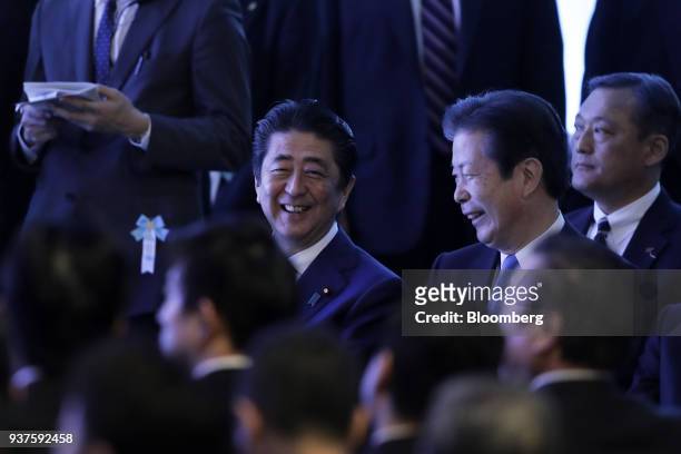Shinzo Abe, Japan's prime minister and president of the ruling Liberal Democratic Party , center left, and Natsuo Yamaguchi, chief representative of...