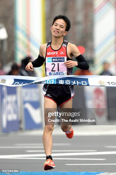 Hiroto Inoue of Japan crosses the finish line during the Tokyo Marathon 2018 in Tokyo, Japan.