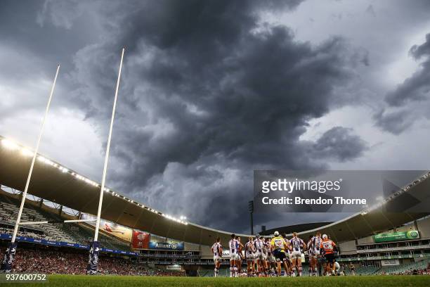 Knights players gather after conceding a try during the round three NRL match between the Sydney Roosters and the Newcastle Knights at Allianz...