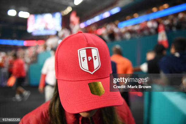 Fan of Peru wears the official match hat of Peru during the international friendly match between Peru and Croatia at Hard Rock Stadium on March 23,...