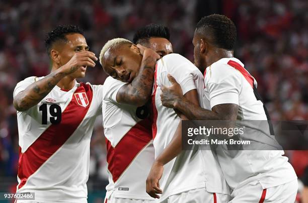 Andre Carrillo of Peru celebrates with teammates Christian Cueva, Jefferson Farfan and Yoshimar Yotun after scoring the first goal of his team during...