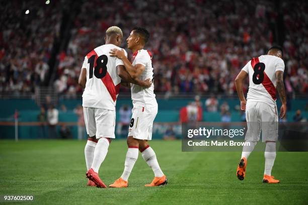 Andre Carrillo of Peru celebrates with teammates after scoring the first goal of his team during the international friendly match between Peru and...