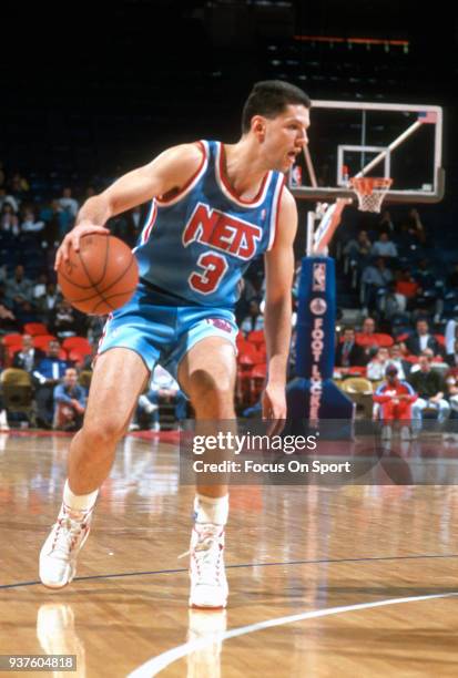 Drazen Petrovic of the New Jersey Nets dribbles the ball against the Washington Bullets during an NBA basketball game circa 1991 at the Capital...