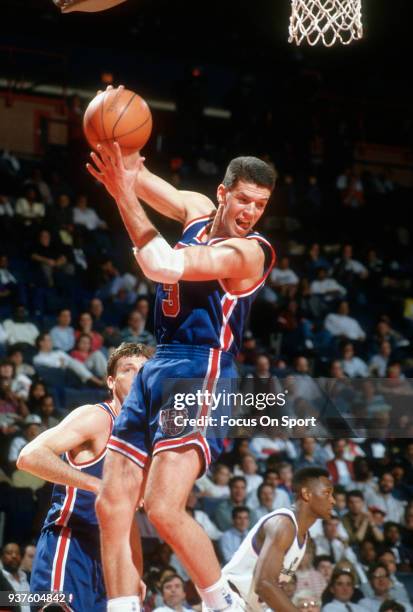 Drazen Petrovic of the New Jersey Nets grabs a rebound against the Washington Bullets during an NBA basketball game circa 1992 at the Capital Centre...