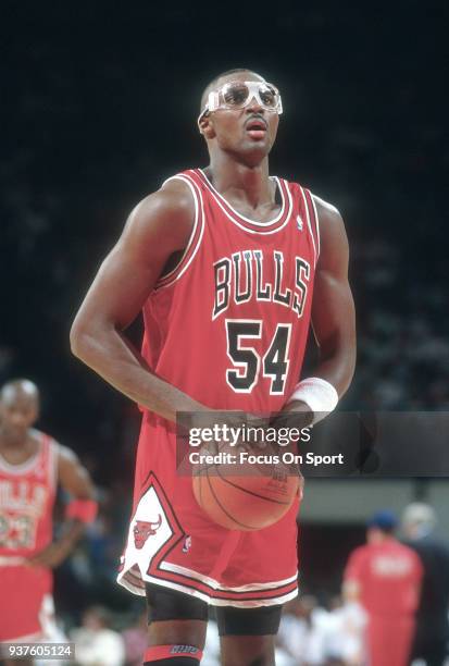 Horace Grant of the Chicago Bulls shoots a free throw against the Washington Bullets during an NBA basketball game circa 1990 at the Capital Centre...