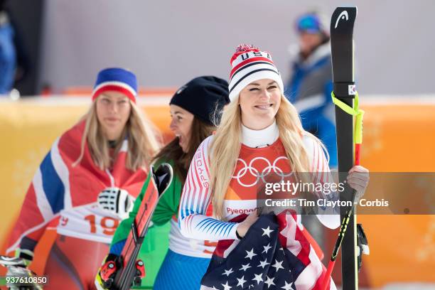 Bronze medal winner Lindsey Vonn of the United States, gold medal winner Sofia Goggia from Italy and silver medal winner Ragnhild Mowinckel of Norway...