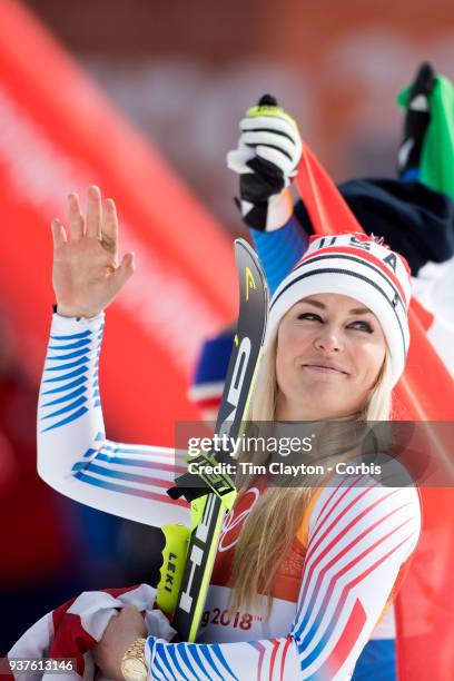 Bronze medal winner Lindsey Vonn of the United States waves to the crowd during the presentations after the Alpine Skiing - Ladies' Downhill race at...