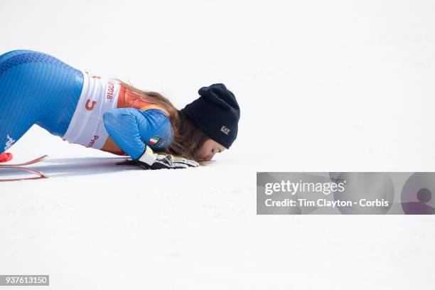 Gold medal winner Sofia Goggia of Italy kisses the snow during presentations after the Alpine Skiing - Ladies' Downhill race at Jeongseon Alpine...