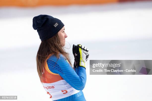 Gold medal winner Sofia Goggia of Italy takes a moment to reflect after the presentations during the Alpine Skiing - Ladies' Downhill race at...