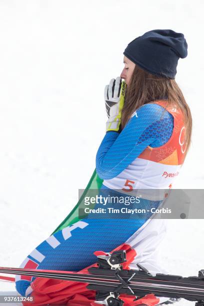 Gold medal winner Sofia Goggia of Italy takes a moment to reflect after the presentations during the Alpine Skiing - Ladies' Downhill race at...