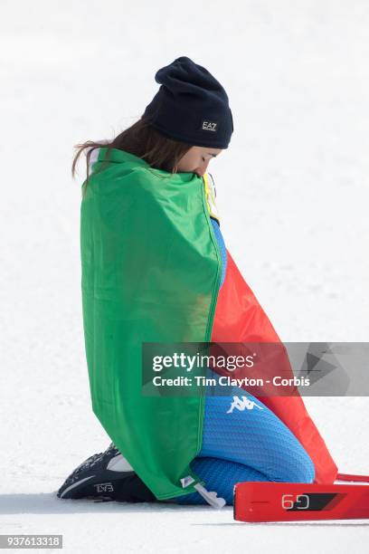 Gold medal winner Sofia Goggia of Italy takes a moment to reflect after the presentations during the Alpine Skiing - Ladies' Downhill race at...