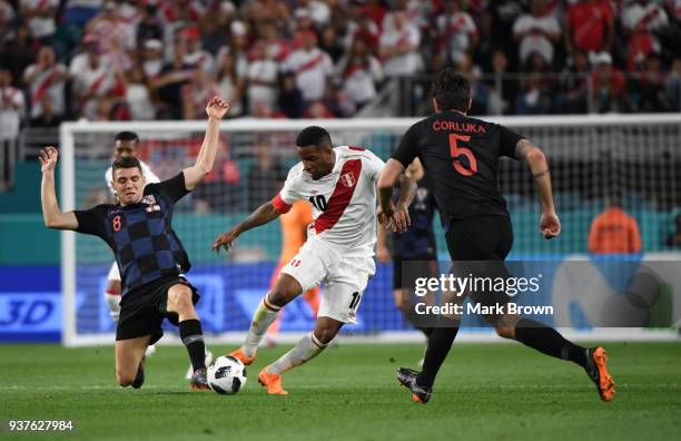 Jefferson Farfan of Peru fights for the ball with Mateo Kovačić and Verdan Ćorluka of Croatia during the international friendly match between Peru...