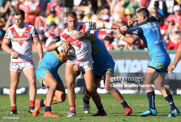 Jack De Belin of the Dragons takes on the defence during the round three NRL match between the Gold Coast Titans and the St George Illawarra Dragons...