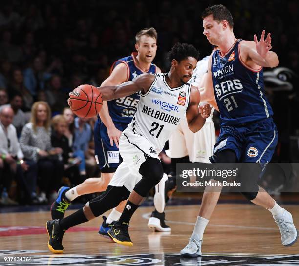 Casper Ware of Melbourne United drives towards Daniel Johnson of the Adelaide 36ers during game four of the NBL Grand Final series between the...