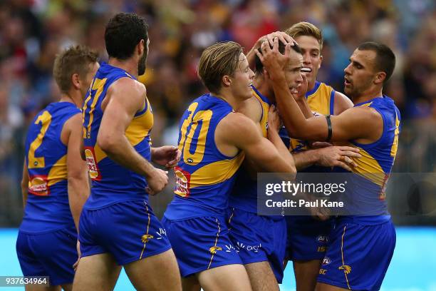 Shannon Hurn of the Eagles is congratulated by team mates after kicking a goal during the round one AFL match between the West Coast Eagles and the...