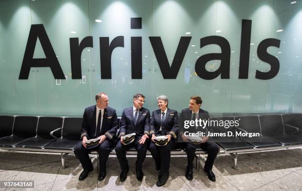 First Officer Dave Summergreene, Captain Jeff Foote, Captain Lisa Norman and second officer Troy Lane sit in arrivals at Heathrow Terminal 3 after...
