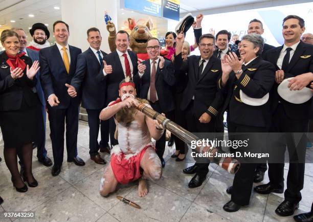 Qantas Group CEO Alan Joyce celebrates with passengers and crew at Heathrow Airport on March 25, 2018 in London, United Kingdom. The historic flight...