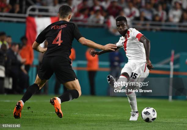 Christian Ramos of Peru passes the ball over Ivan Perisic of Croatia during the international friendly match between Peru and Croatia at Hard Rock...