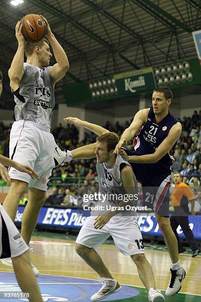 Donatas Zavackas, #14 of Lietuvos Rytas competes with and Martynas Gecevicius, #13 of Lietuvos Rytas competes with and Bostjan Nachbar, #21 of Efes...