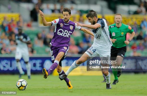 Terry Antonis and Xavi Torres battle for the ball during the round 24 A-League match between the Perth Glory and the Melbourne Victory at nib Stadium...