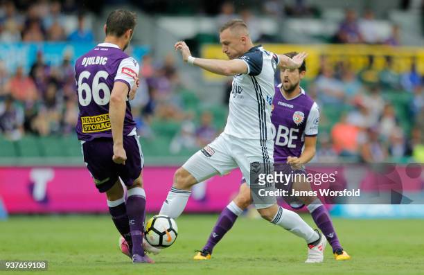 Besart Berisha works through the Perth glory defence during the round 24 A-League match between the Perth Glory and the Melbourne Victory at nib...