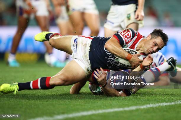 Cooper Cronk of the Roosters dives to score a try during the round three NRL match between the Sydney Roosters and the Newcastle Knights at Allianz...