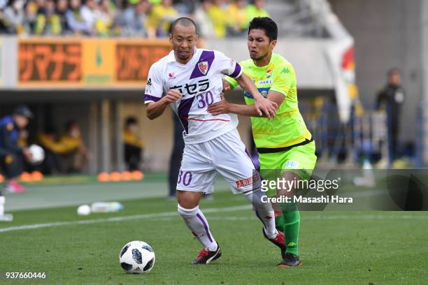 Yosuke Ishibitsu of Kyoto Sanga and Andrew Kumagai of JEF United Chiba compete for the ball during the J.League J2 match between JEF United Chiba and...