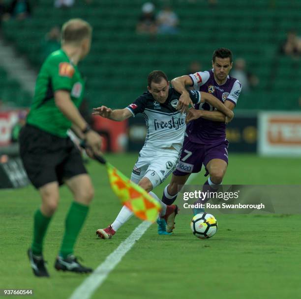 Joel Chianese of the Glory contests the ball against Leigh Broxham of the Victory on the boundary at nib Stadium on March 25, 2018 in Perth,...