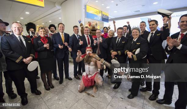Qantas staff and passengers celebrate in the arrivals hall at Terminal 3 at Heathrow Airport on March 25, 2018 in London, United Kingdom. The...