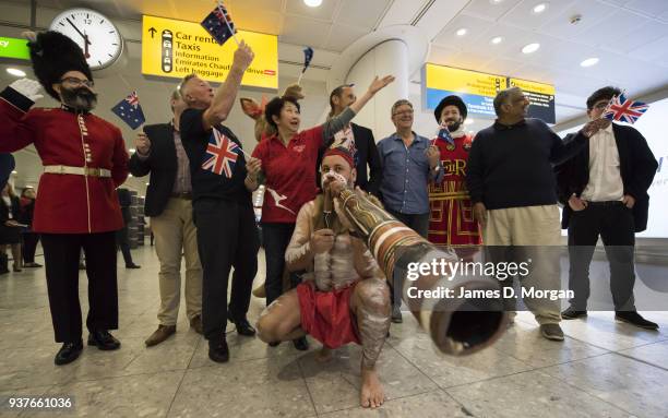 Qantas staff and passengers celebrate in the arrivals hall at Terminal 3 at Heathrow Airport on March 25, 2018 in London, United Kingdom. The...